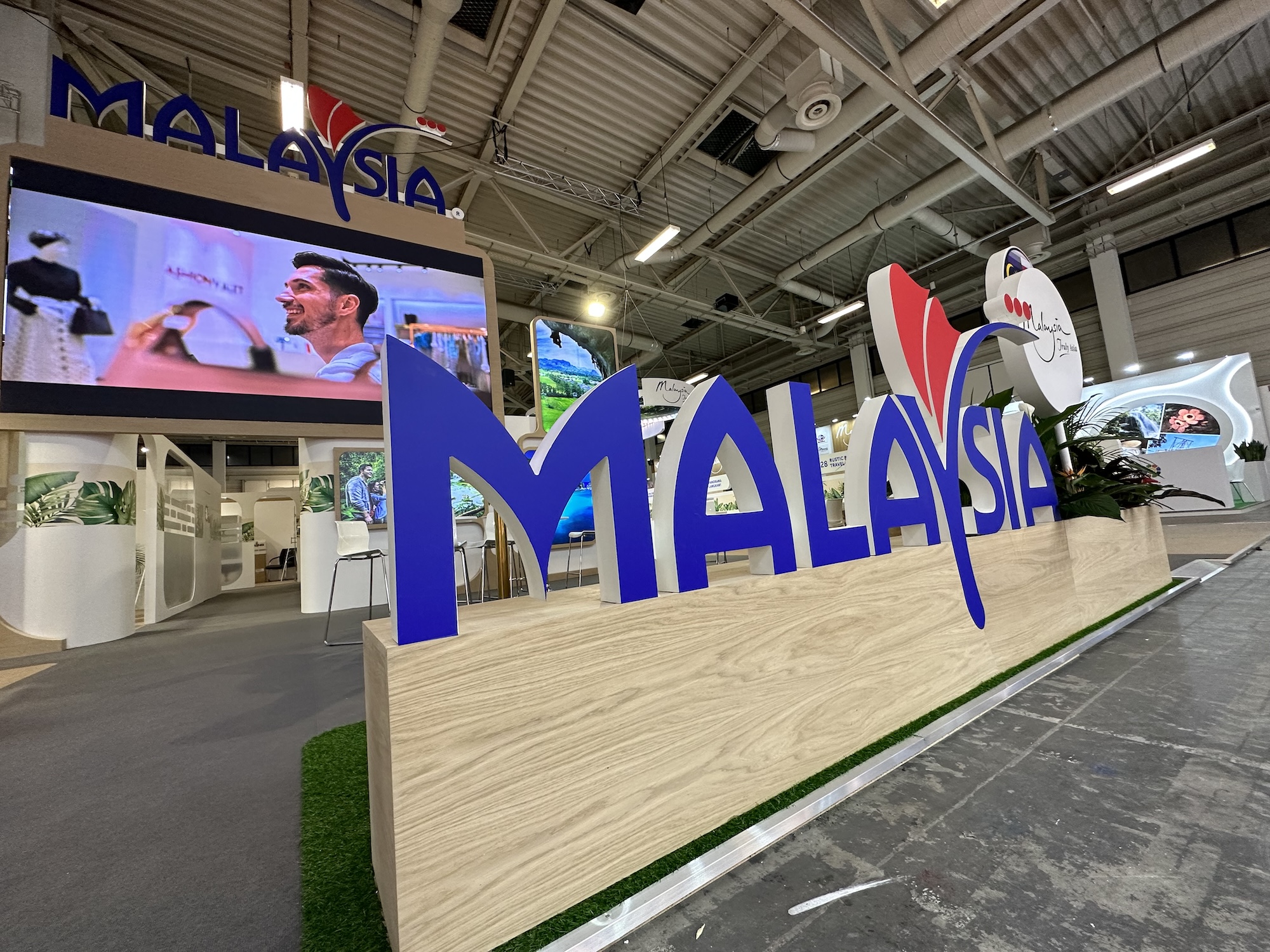 Malaysia tourism pavilion with large 3D logo and LED screen